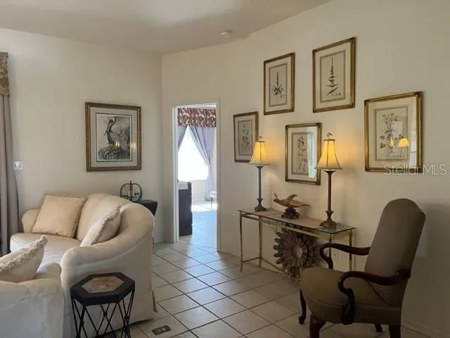 a bedroom with a bed and a mirror on dresser