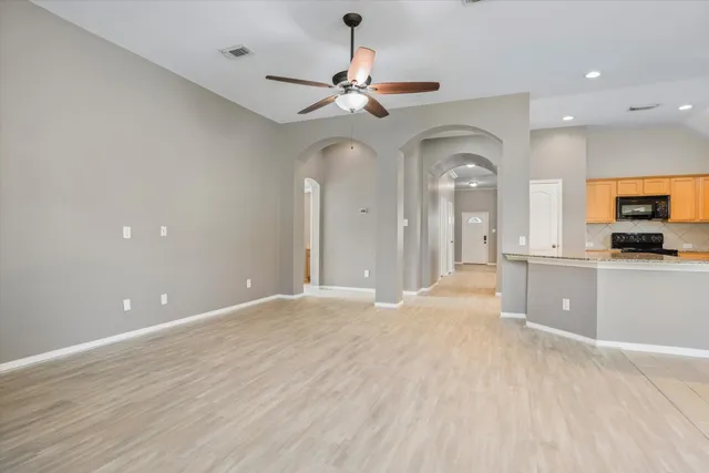 a view of a kitchen with a sink and a fireplace