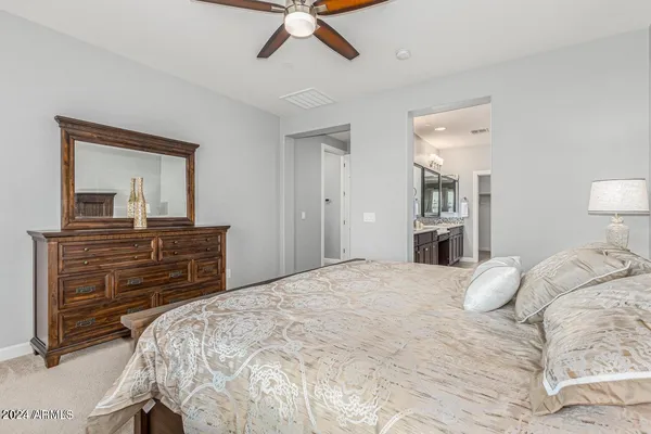 a bedroom with a bed and a dresser