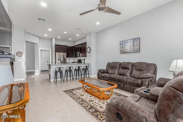 a living room with furniture and a table