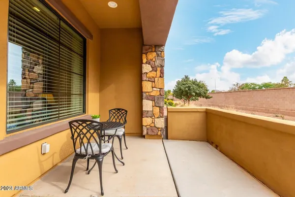 a view of balcony with furniture