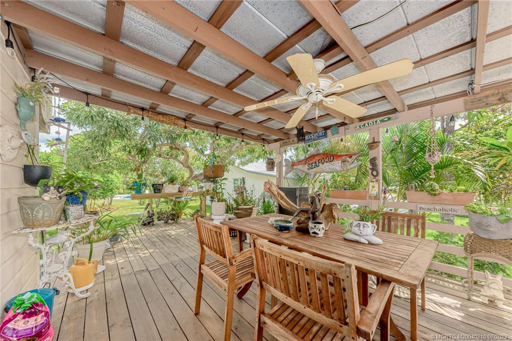 4171 Southeast Robert Loop Road Stuart, FL 34997 - Photo 15 of 27 a view of an outdoor space with seating area
