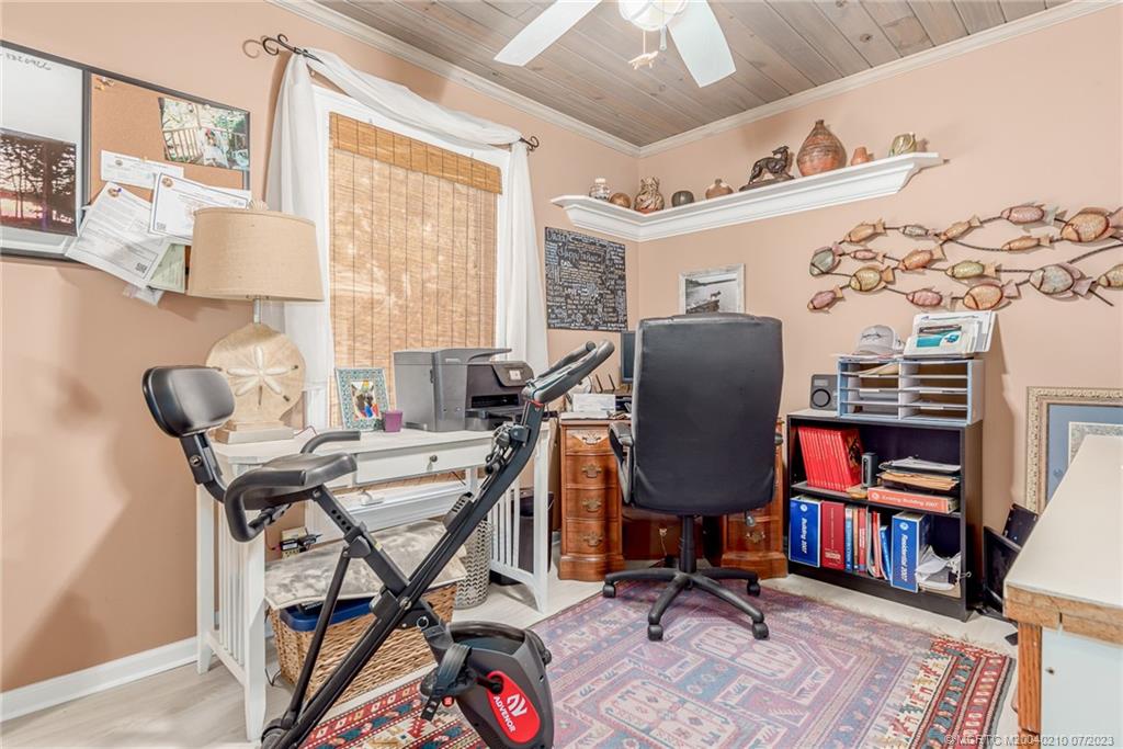 4171 Southeast Robert Loop Road Stuart, FL 34997 - Photo 18 of 27 a view of a workspace with furniture and a window