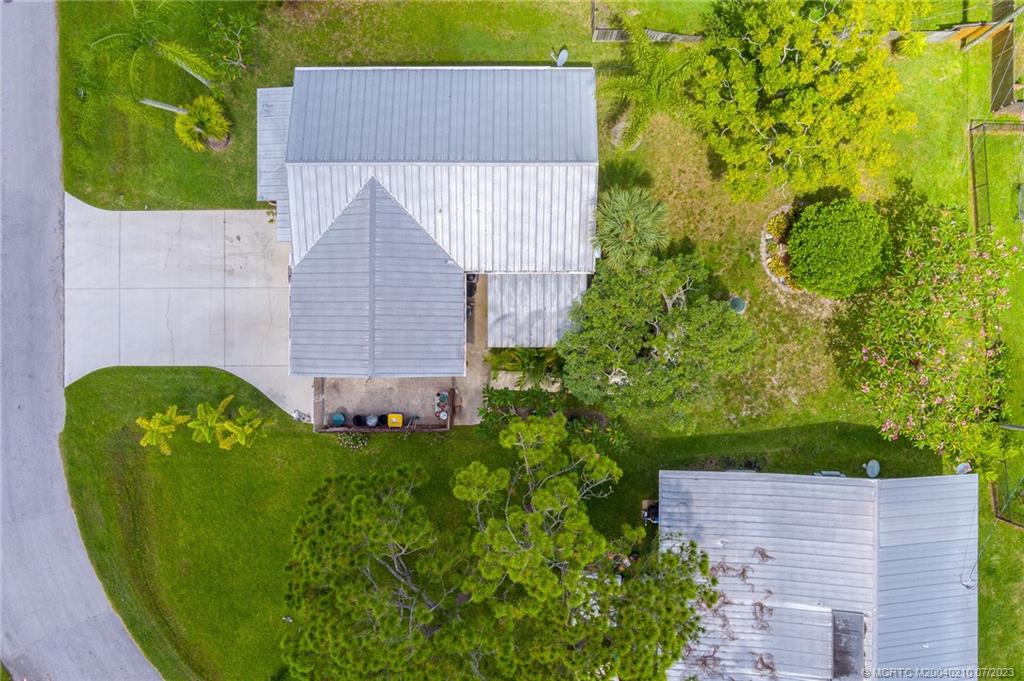 4171 Southeast Robert Loop Road Stuart, FL 34997 - Photo 26 of 27 a aerial view of a house