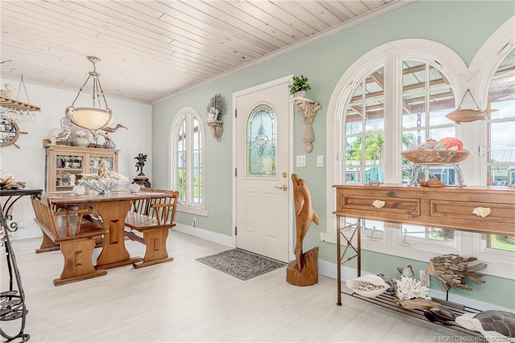 4171 Southeast Robert Loop Road Stuart, FL 34997 - Photo 4 of 27 a view of a room with gym equipment