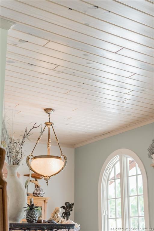 4171 Southeast Robert Loop Road Stuart, FL 34997 - Photo 6 of 27 a room with a chandelier and chandelier