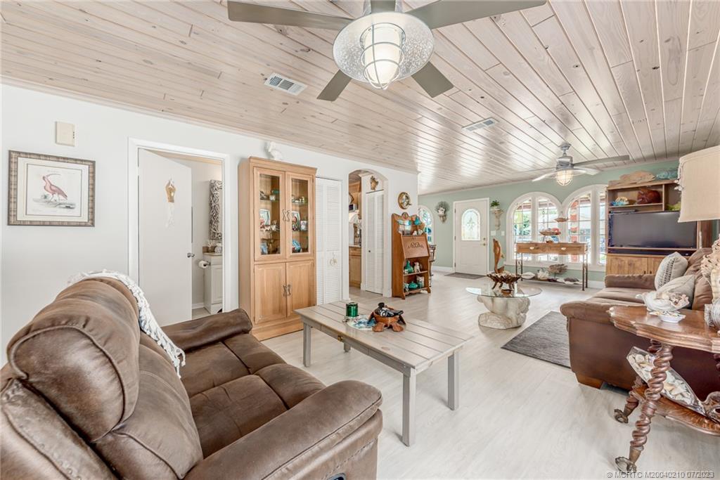 4171 Southeast Robert Loop Road Stuart, FL 34997 - Photo 8 of 27 a living room with furniture