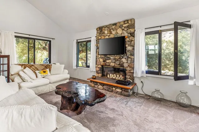 a kitchen with stainless steel appliances a stove a sink and a refrigerator