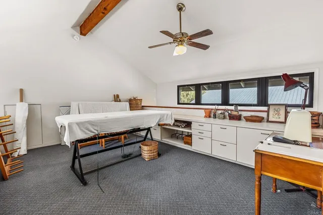 a bedroom with furniture and a wooden floor