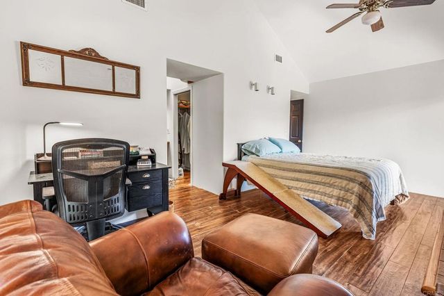 a view of a patio with a table and chairs