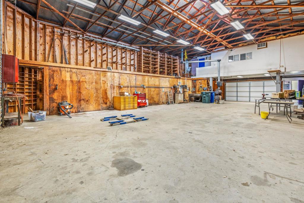 29533 Anthony Road Valley Center, CA 92082 - Photo 33 of 71 Note vehicle hoist Shop has a large air compressor with air and electric throughout.