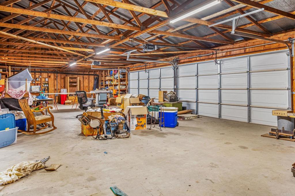 29533 Anthony Road Valley Center, CA 92082 - Photo 35 of 71 West section with garage doors and work bays at either end.