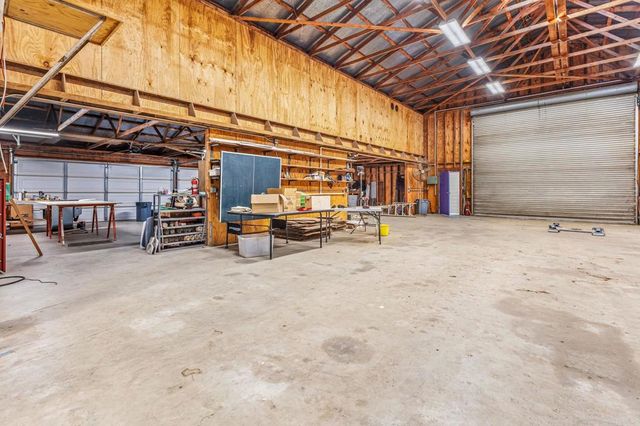 a bed room with a bed and a television