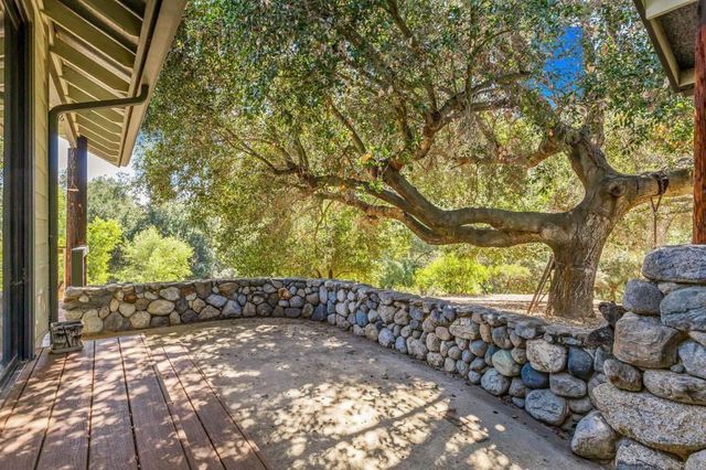 a view of a backyard with sitting area