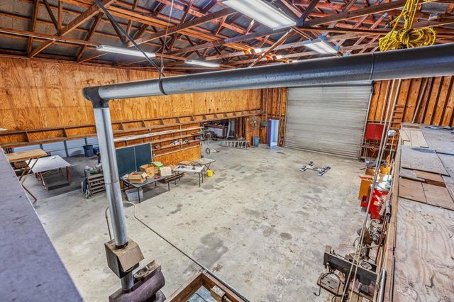 a view of a town with large trees