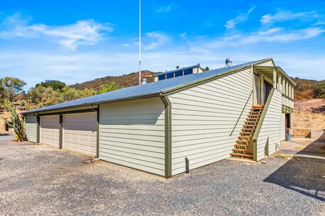 a view of a house with backyard and chair