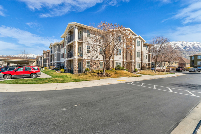 1136 West Spencer Road, Unit Y203 Pleasant Grove, UT 84062 - Photo 22 of 26 View of apartment building / complex with a mountain view