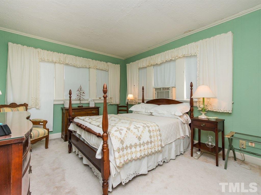 2320 Anderson Drive Raleigh, NC 27608 - Photo 17 of 25 a bedroom with a bed and a table