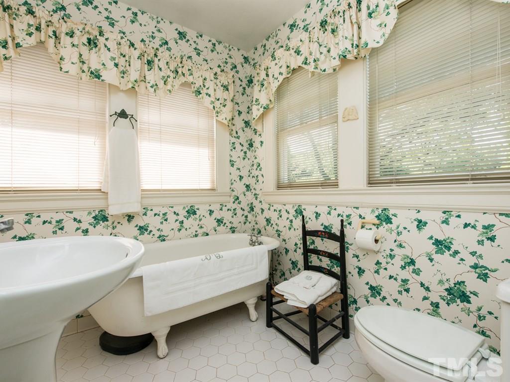 2320 Anderson Drive Raleigh, NC 27608 - Photo 18 of 25 a bathroom with a sink and a mirror