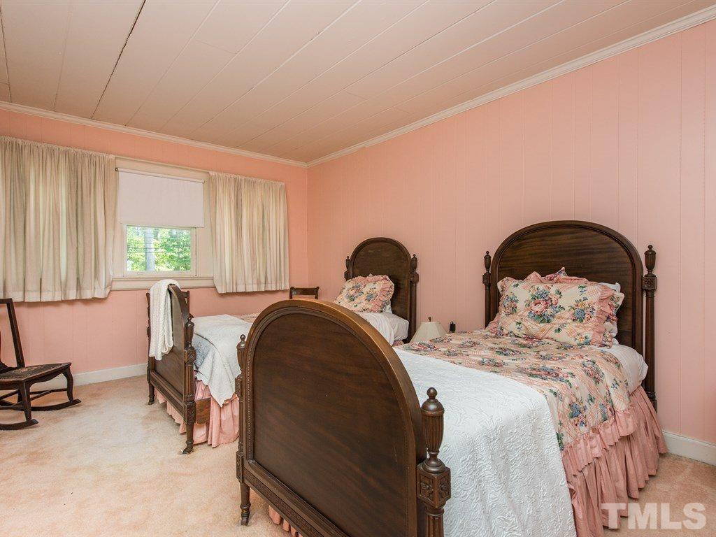 2320 Anderson Drive Raleigh, NC 27608 - Photo 19 of 25 a bedroom with two beds and a window