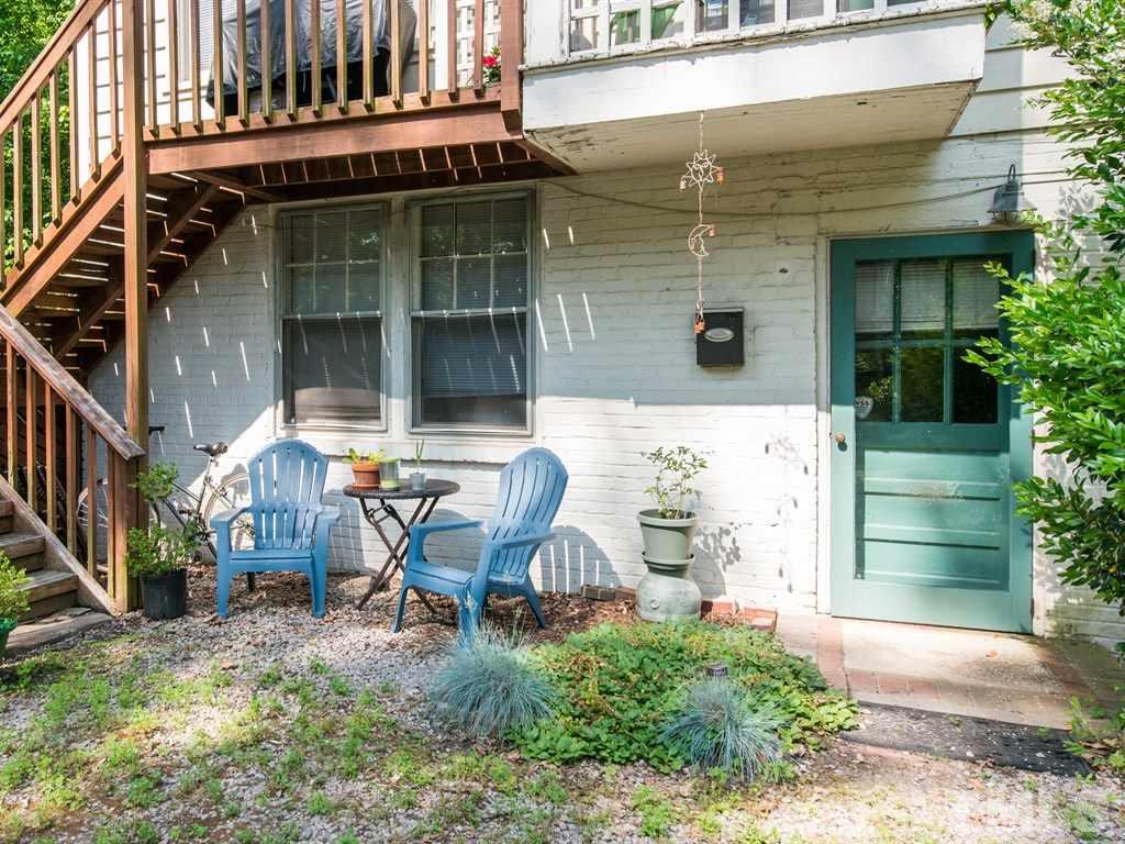 2320 Anderson Drive Raleigh, NC 27608 - Photo 24 of 25 a backyard of a house with outdoor seating