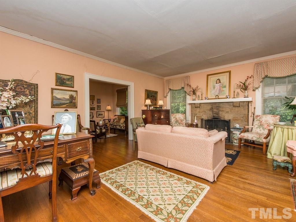 2320 Anderson Drive Raleigh, NC 27608 - Photo 5 of 25 a living room with furniture and a fireplace