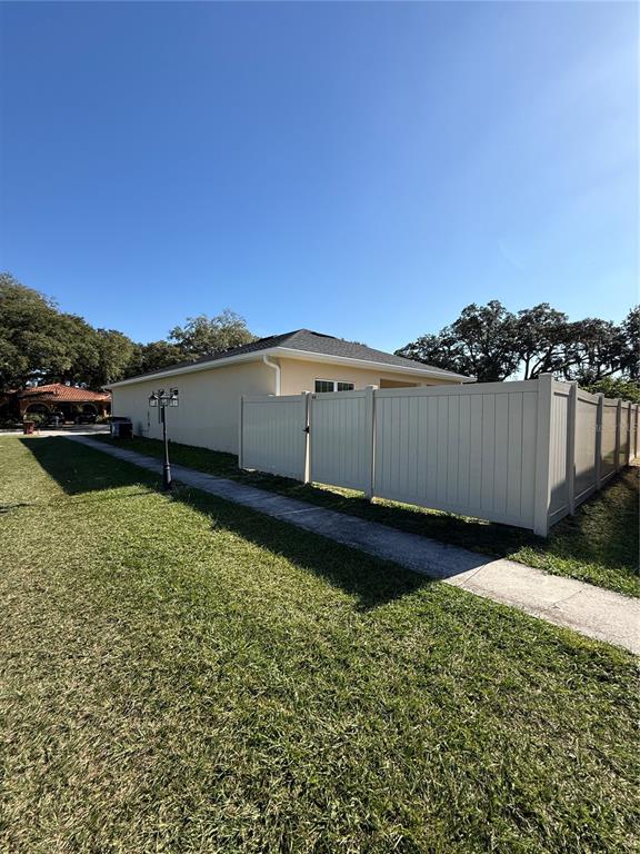 2314 Apache Avenue Kissimmee, FL 34744 - Photo 29 of 29 a view of a backyard with a garden