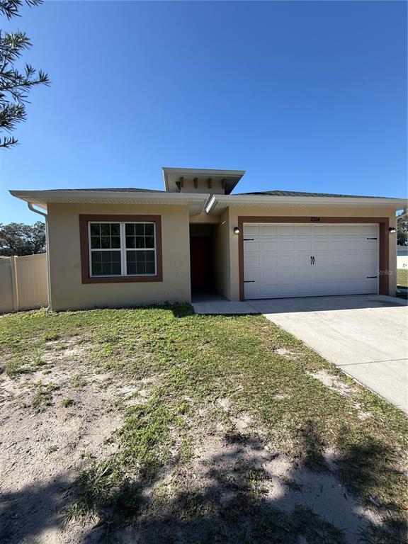 2314 Apache Avenue Kissimmee, FL 34744 - Photo 4 of 29 a front view of a house with a yard