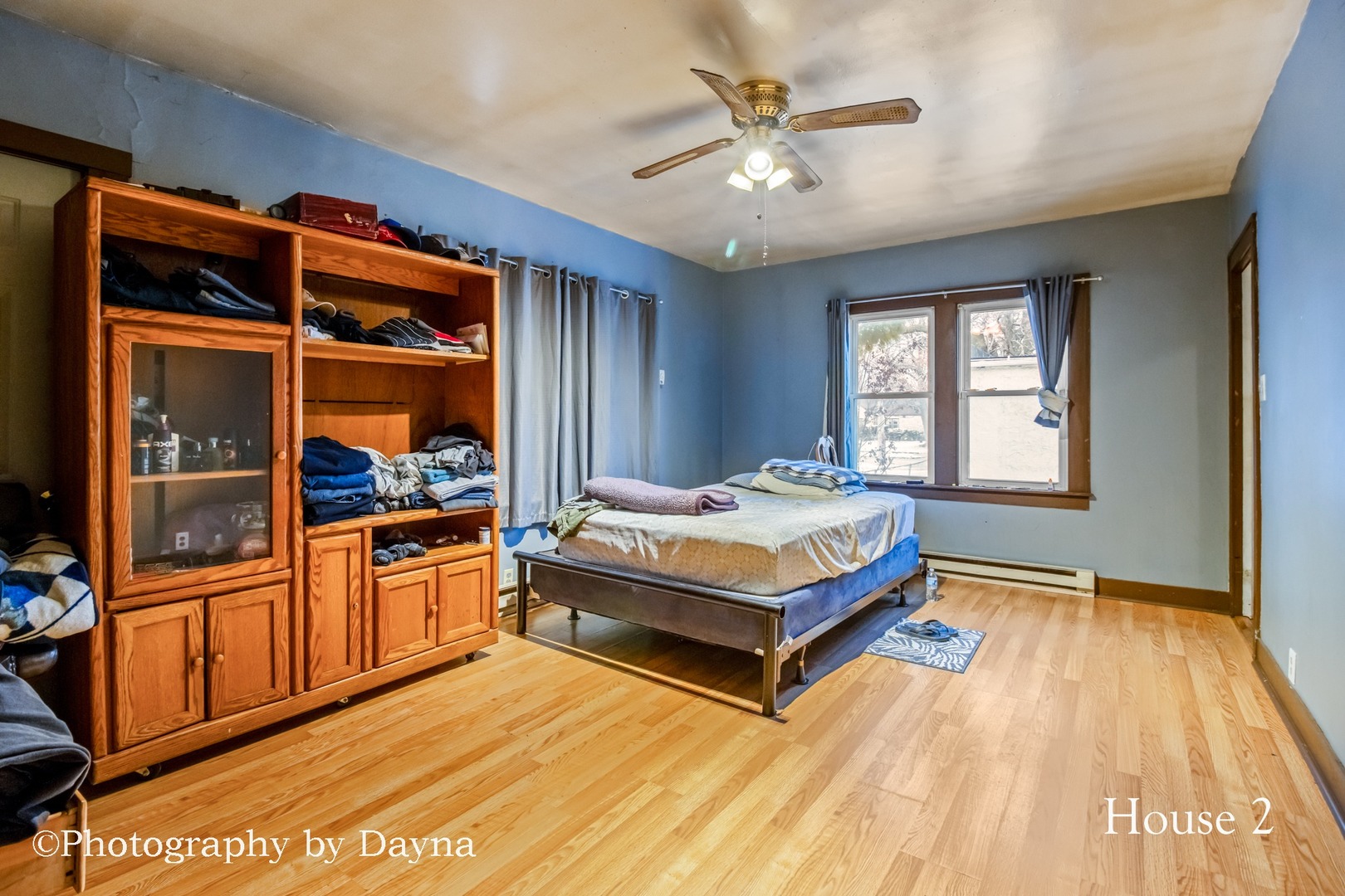 242 West Jeffery Street Kankakee, IL 60901 - Photo 14 of 39 a spacious bedroom with a bed and a chandelier