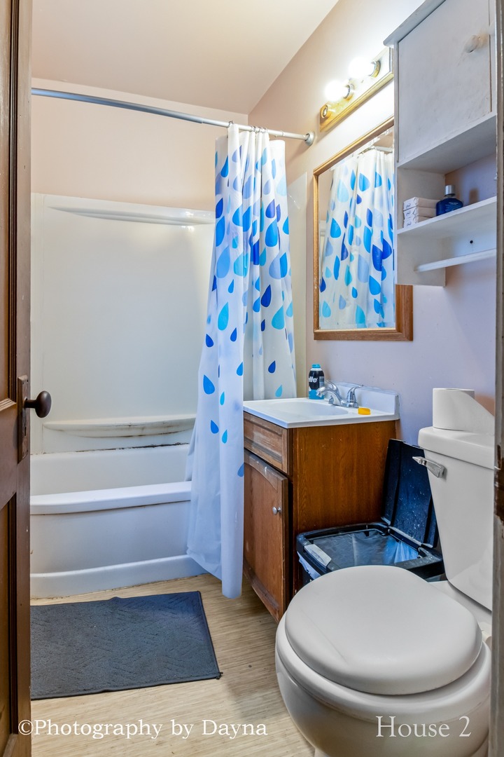 242 West Jeffery Street Kankakee, IL 60901 - Photo 15 of 39 a bathroom with a toilet and a sink