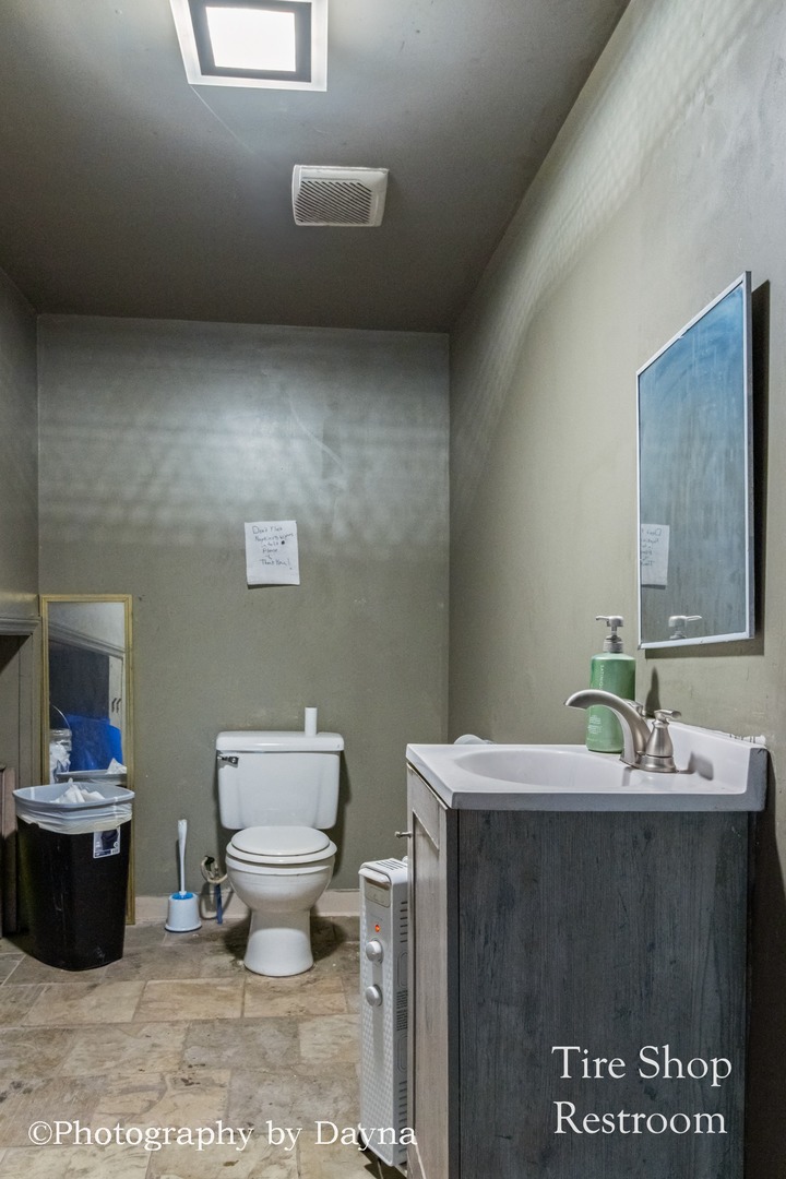 242 West Jeffery Street Kankakee, IL 60901 - Photo 21 of 39 a bathroom with a sink toilet and a mirror