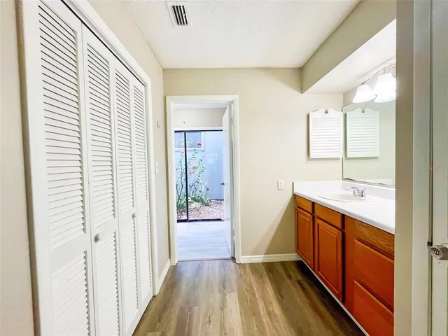 a bathroom with a sink a mirror and a shower