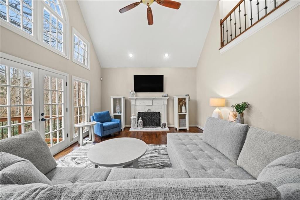 605 Pine Trail Pointe Roswell, GA 30075 - Photo 16 of 76 a living room with furniture a fireplace and a flat screen tv