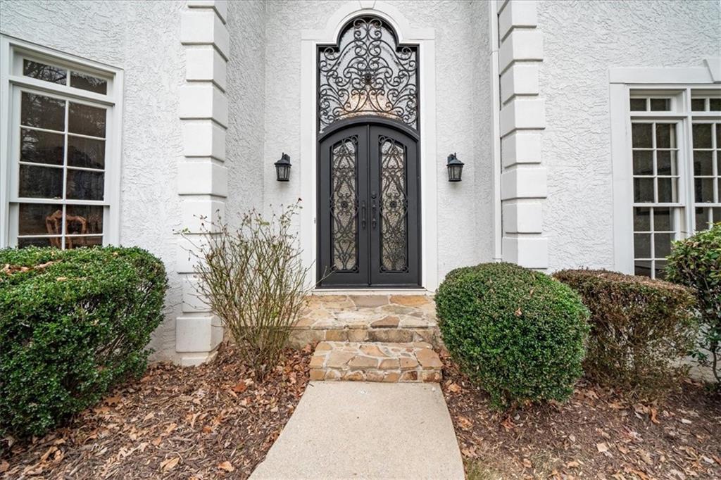 605 Pine Trail Pointe Roswell, GA 30075 - Photo 2 of 76 a front view of a house with garden