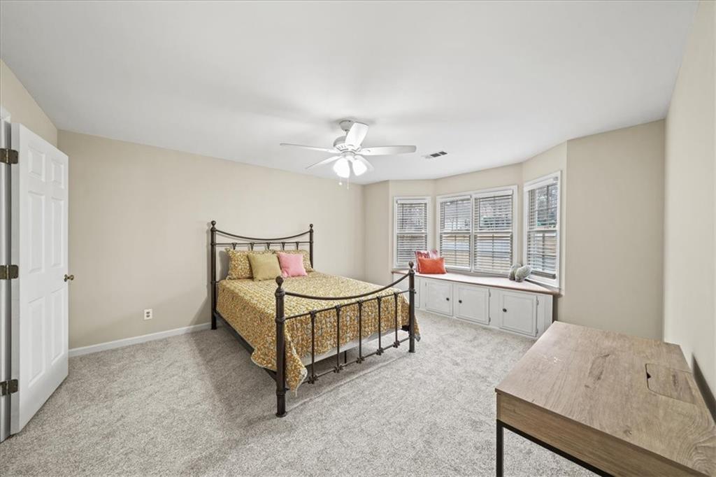 605 Pine Trail Pointe Roswell, GA 30075 - Photo 46 of 76 a spacious bedroom with a bed and a window