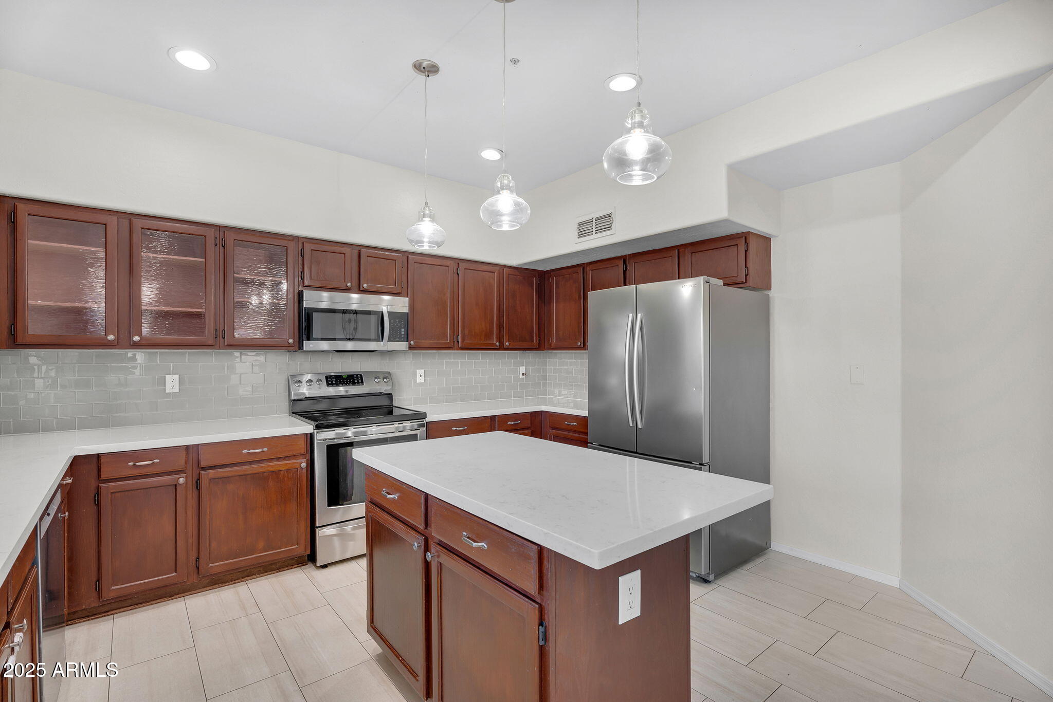 14566 North 100th Place Scottsdale, AZ 85260 - Photo 12 of 34 a kitchen with stainless steel appliances a sink stove and refrigerator