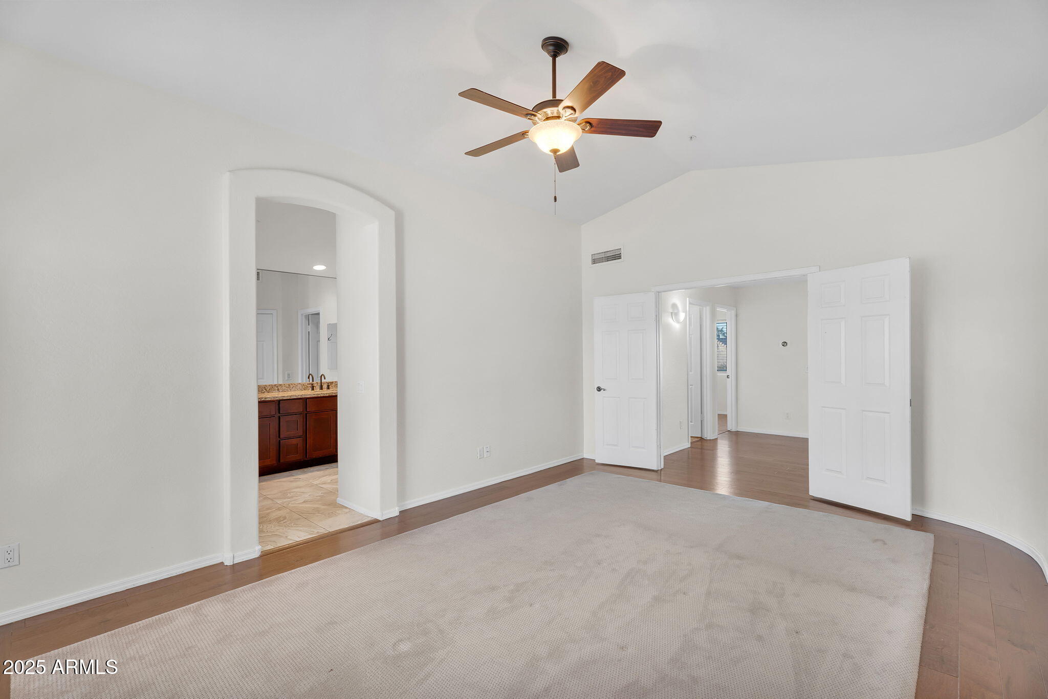 14566 North 100th Place Scottsdale, AZ 85260 - Photo 17 of 34 a view of an empty room with a ceiling fan