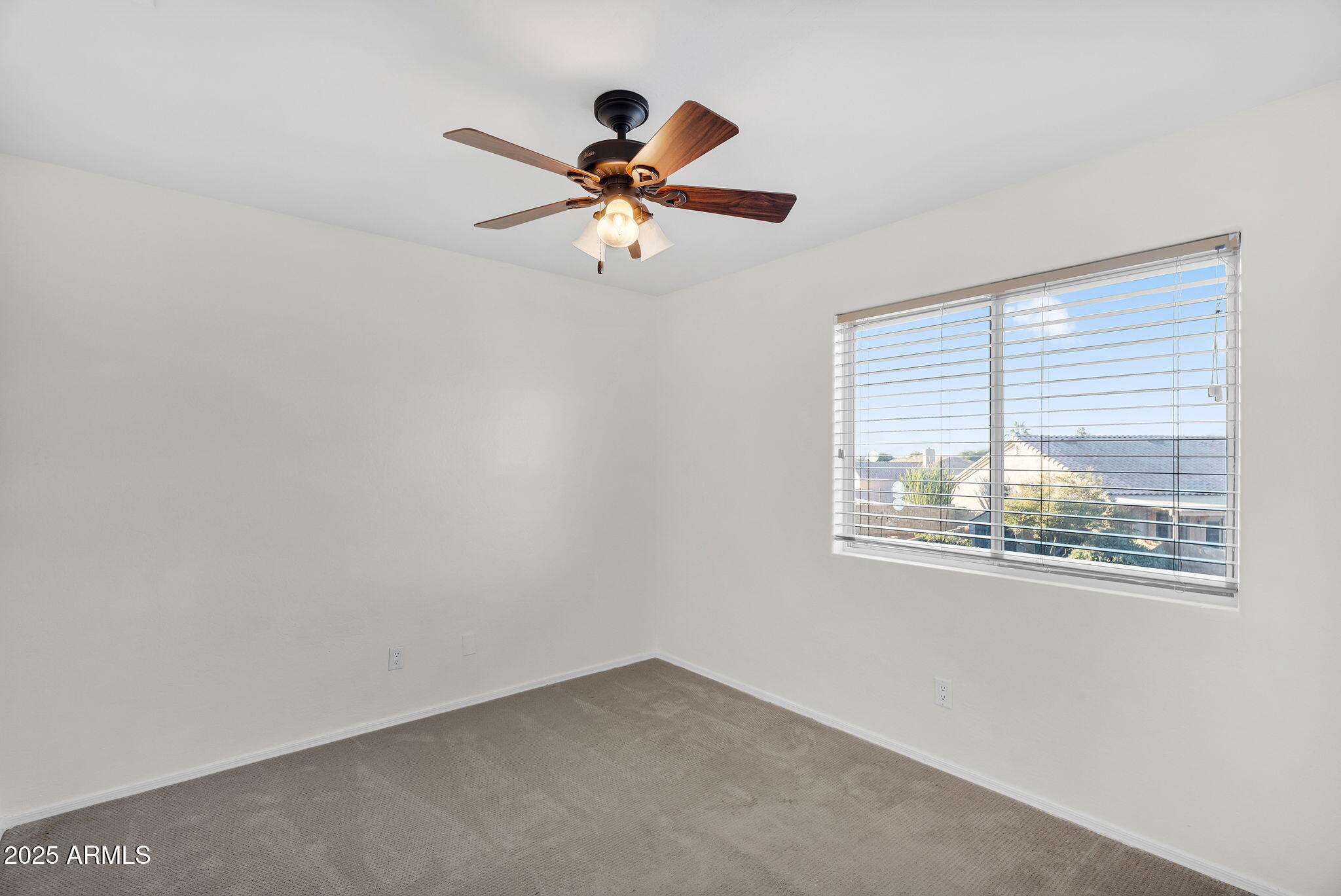 14566 North 100th Place Scottsdale, AZ 85260 - Photo 22 of 34 a view of empty room with wooden floor and fan