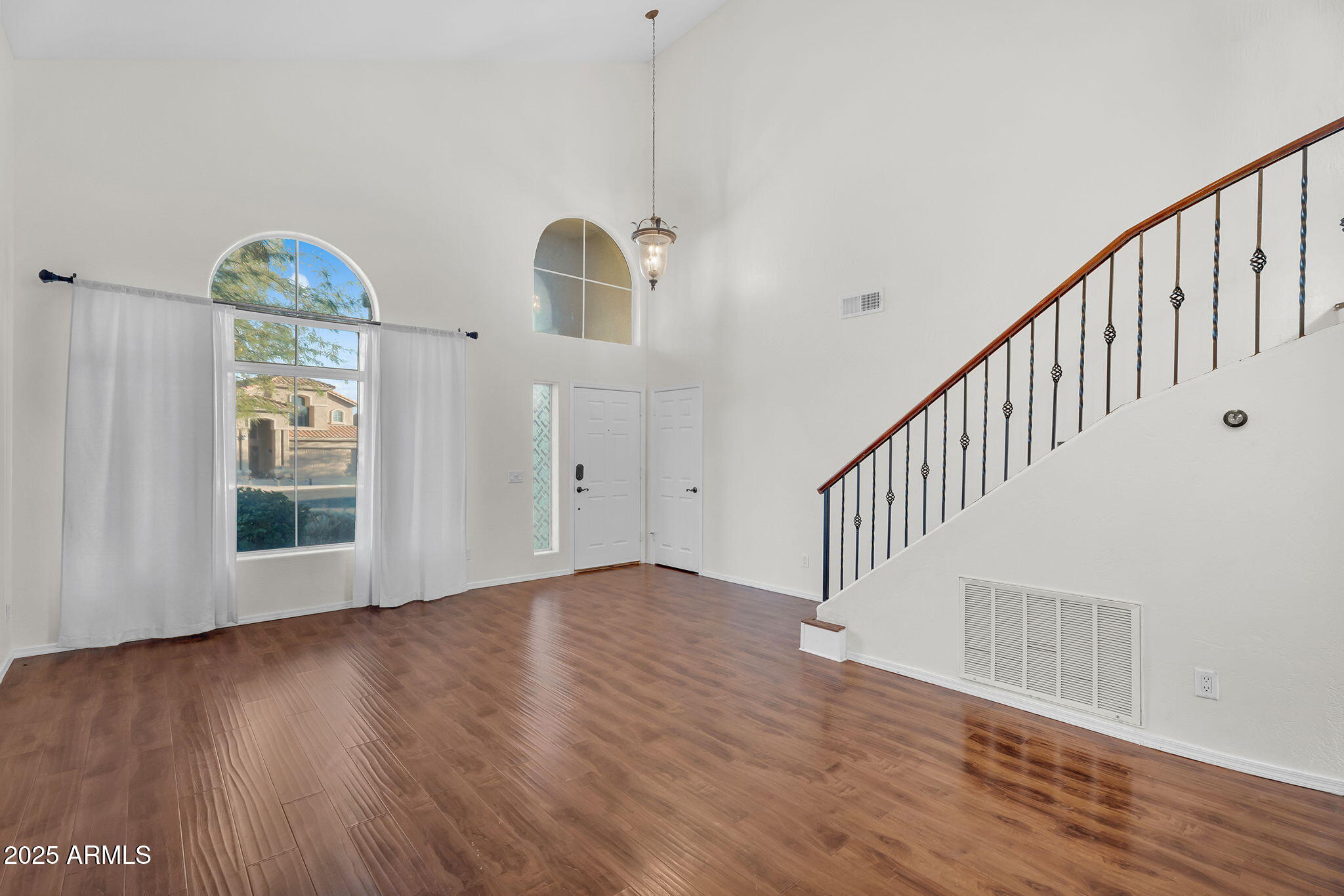 14566 North 100th Place Scottsdale, AZ 85260 - Photo 5 of 34 a view of an entryway with wooden floor
