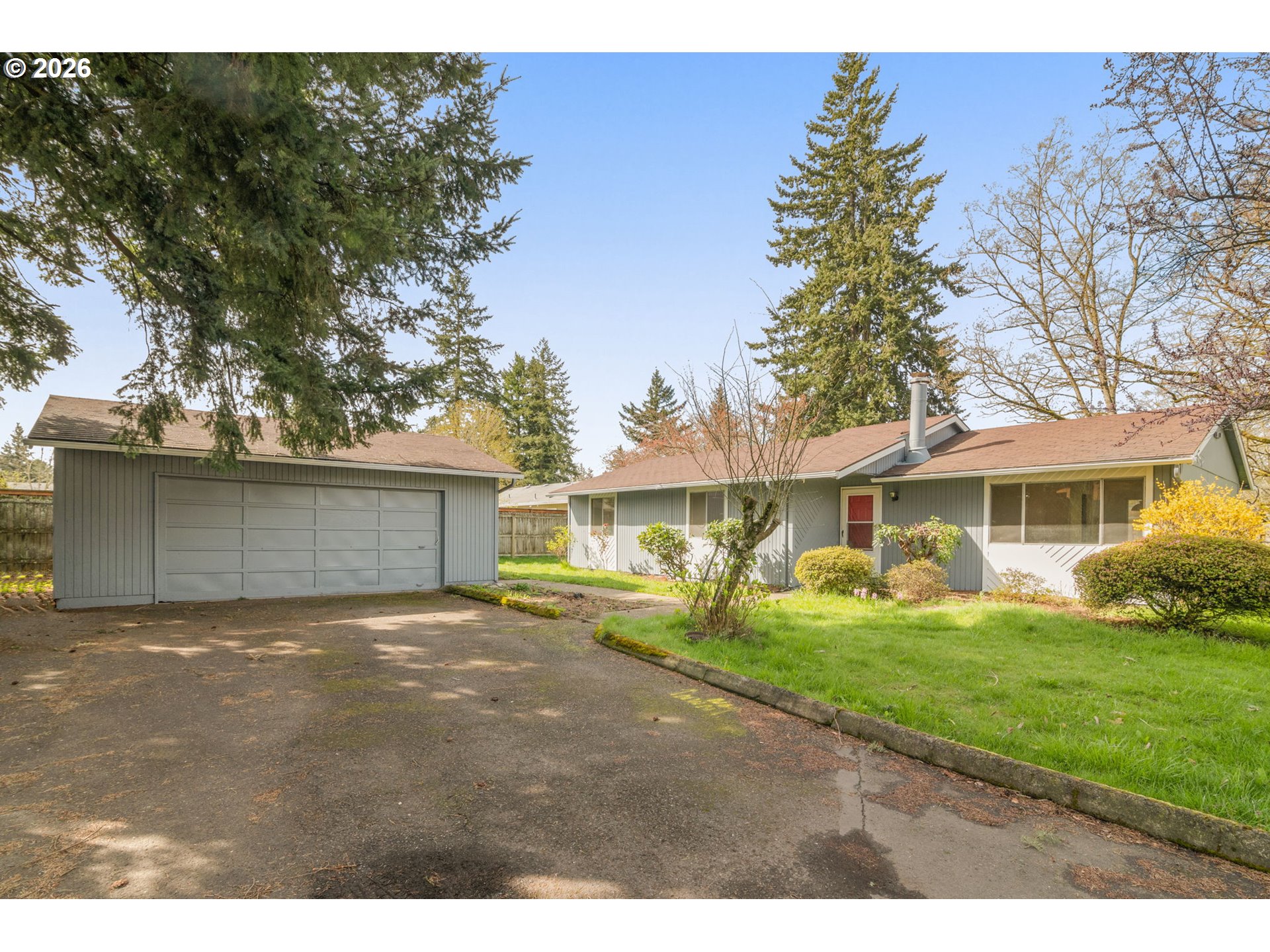 2635 Southeast 170th Avenue Portland, OR 97236 - Photo 1 of 22 a view of a yard in front of a house