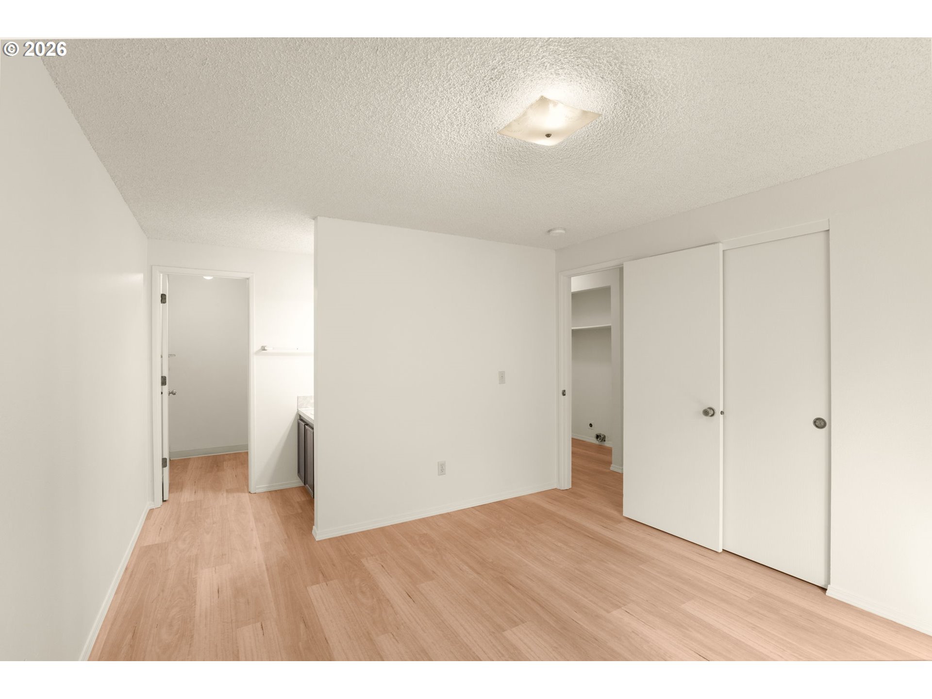2635 Southeast 170th Avenue Portland, OR 97236 - Photo 12 of 22 a view of an empty room and wooden floor