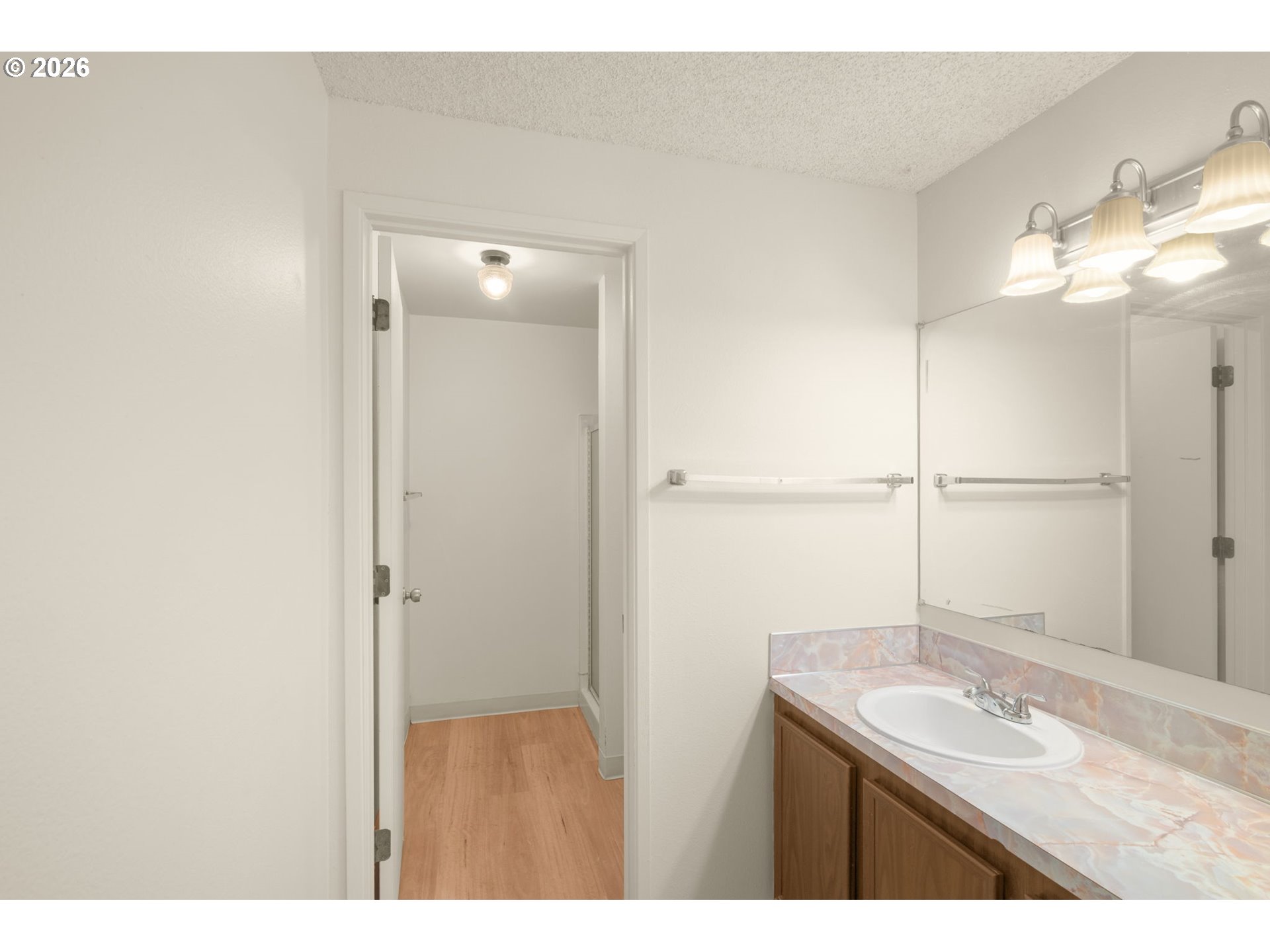 2635 Southeast 170th Avenue Portland, OR 97236 - Photo 13 of 22 a bathroom with a sink and a mirror