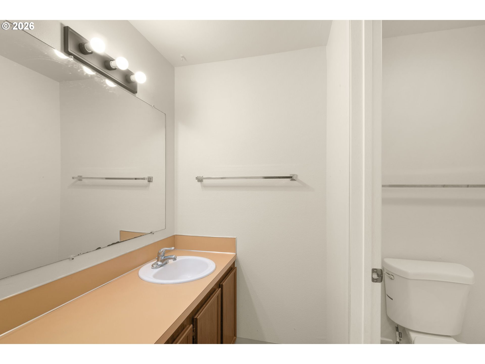 2635 Southeast 170th Avenue Portland, OR 97236 - Photo 14 of 22 a bathroom with a sink and a mirror