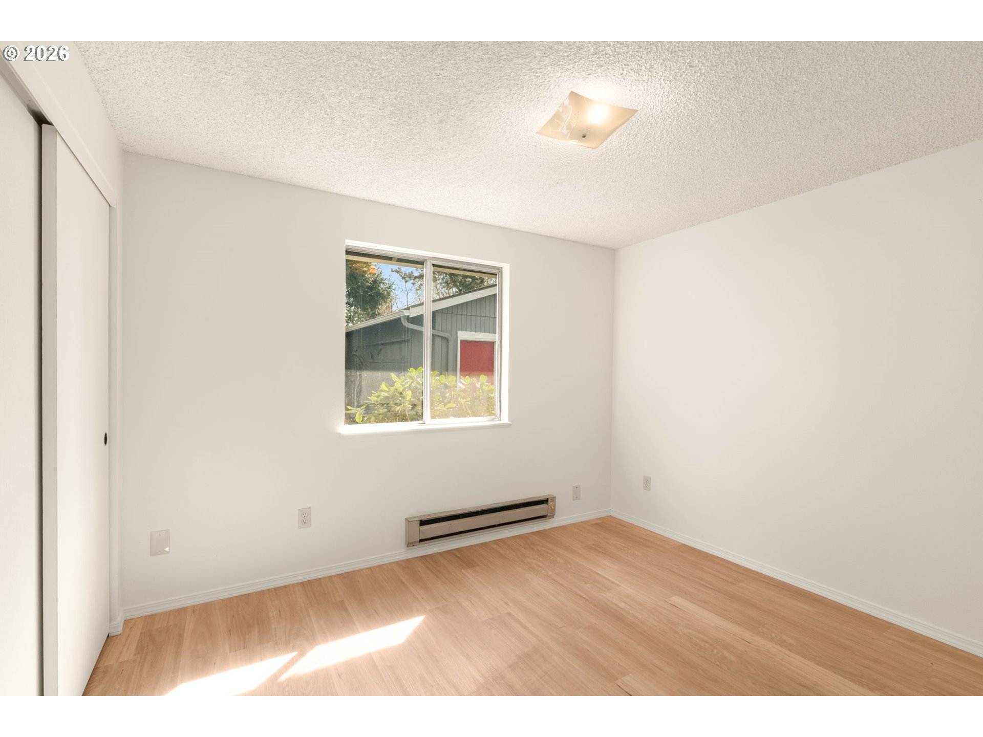 2635 Southeast 170th Avenue Portland, OR 97236 - Photo 17 of 22 an empty room with windows and closet