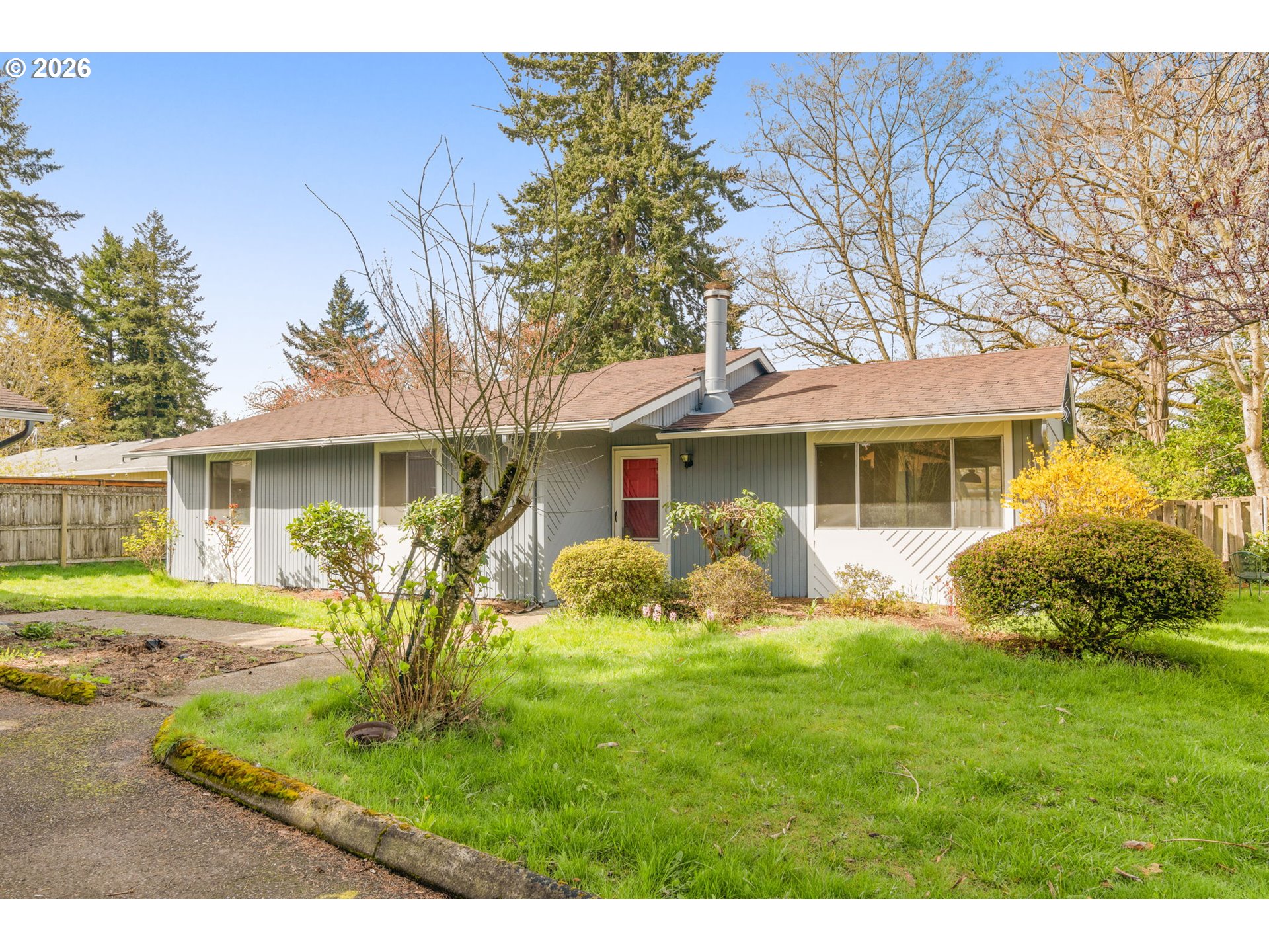 2635 Southeast 170th Avenue Portland, OR 97236 - Photo 2 of 22 a front view of a house with yard and green space