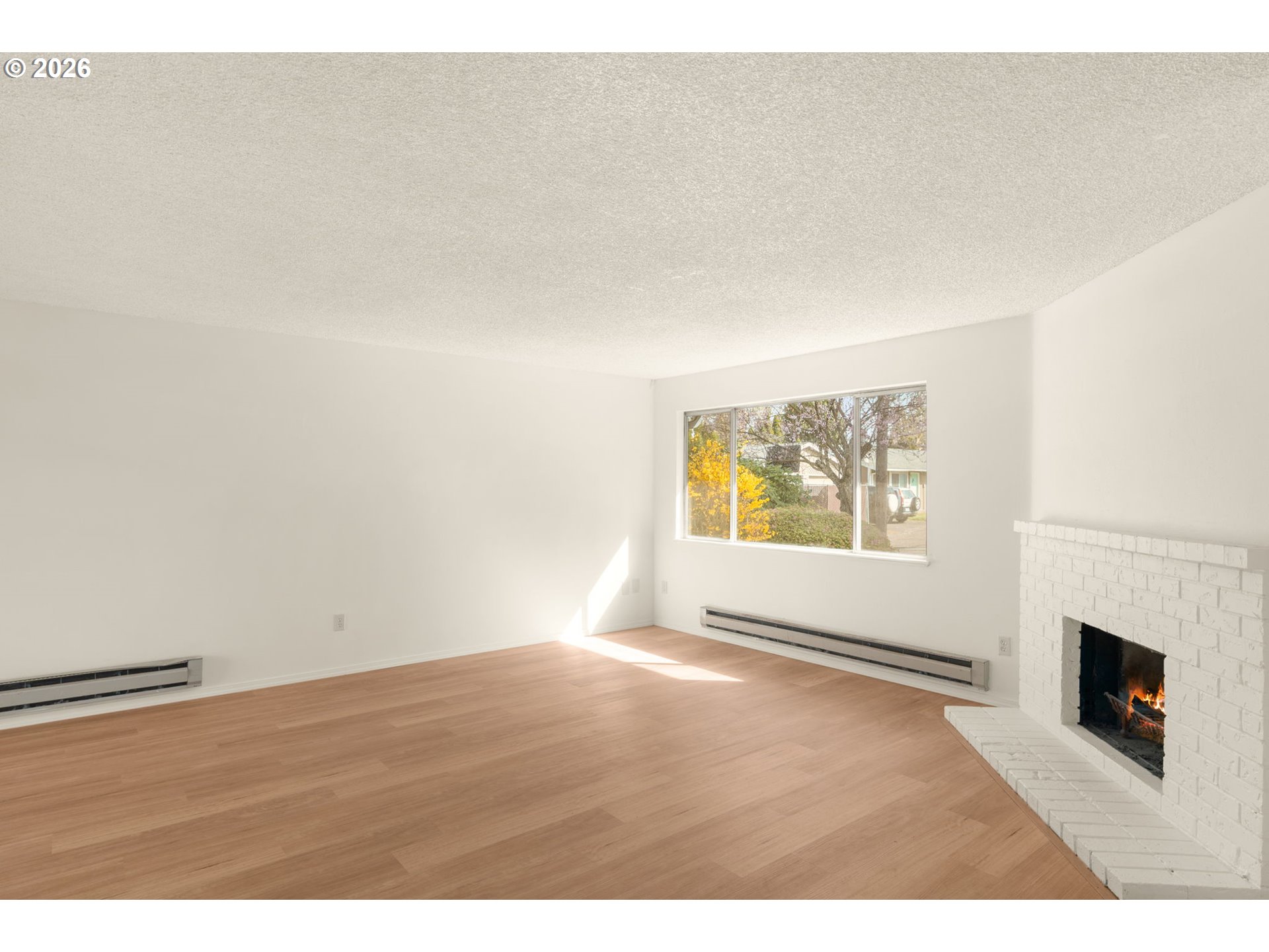 2635 Southeast 170th Avenue Portland, OR 97236 - Photo 6 of 22 a view of empty room with window and fireplace