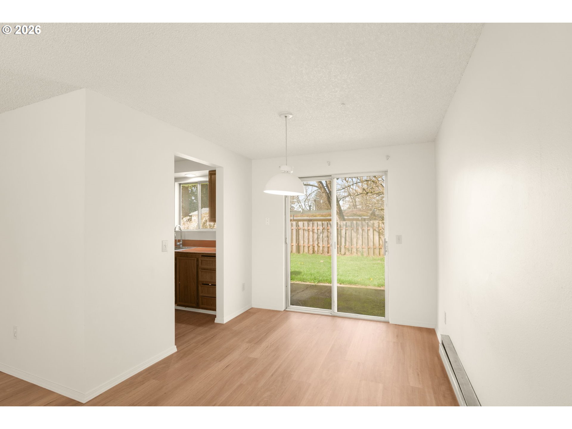2635 Southeast 170th Avenue Portland, OR 97236 - Photo 8 of 22 a view interior of a house with wooden floor and windows