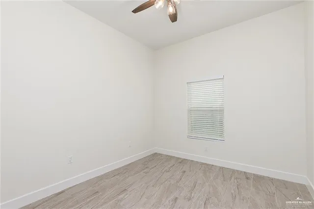 an empty room with a empty space and a window