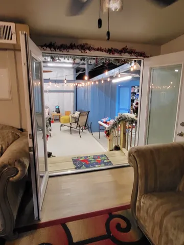 a view of kitchen with furniture and a chandelier
