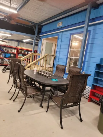 a dining room with furniture and window